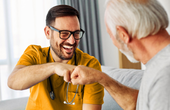 Doctor and patient sharing a positive moment focused on prevention and preventive healthcare.