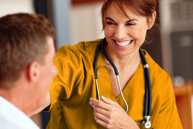 Healthcare professional in a personal conversation with a patient.